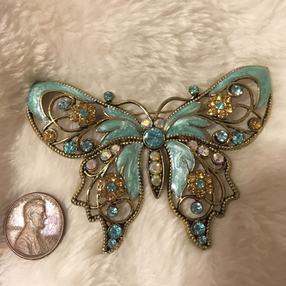Butterfly gold tone brooch